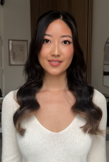 Front portrait with smile; natural makeup and waves.